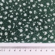 Cotton 100% white meadow on a dark green background, small flowers
