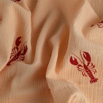 100% cotton muslin, red crayfish on apricot