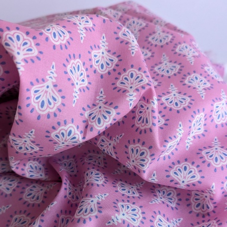 Cotton batiste fabric with ornament on a pink background