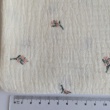 Cotton muslin, embroidered, salmon flowers, twigs on a cream background