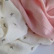 Cotton muslin, embroidered, salmon flowers, twigs on a cream background