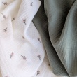 Cotton muslin, embroidered, salmon flowers, twigs on a cream background