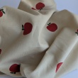 100% cotton, babycord, apples on a beige background