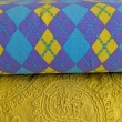 Single jersey, purple and yellow argyle pattern