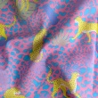 Cotton batiste fabric with leopard on a pink background