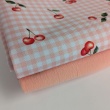 Waterproof fabric, Oxford, cherries on a salmon checkered background