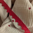 Double gauze 100% cotton, red hearts on a beige background