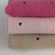 Double gauze 100% cotton, red hearts on a light pink background