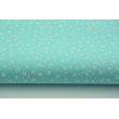 Cotton 100% white meadow on a turquoise background, small flowers